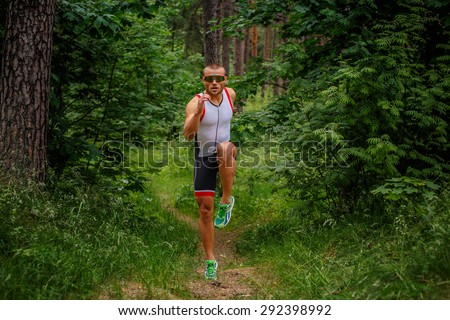 Running man on nature path.