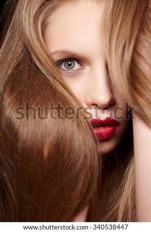 Hairy blond woman with red lips.