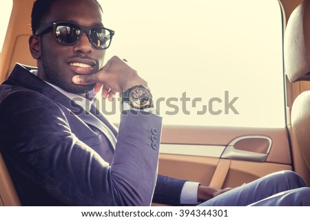 Stylish black man in the car.