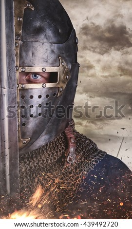 Close up portrait of a man in knight helmet.