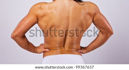 Close image of muscle woman from back