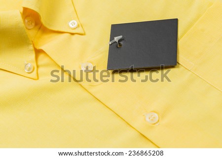 Close up yellow shirt with label