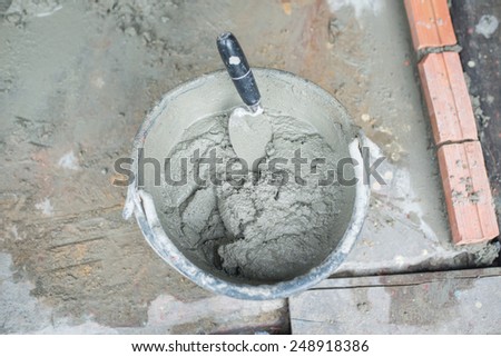 Mixing a cement in tank for applying construction.
