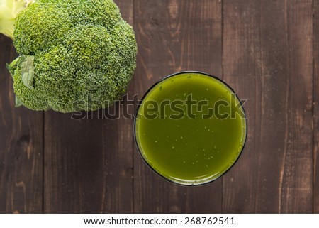 Top shot broccoli juice on wood table