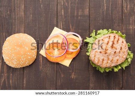 Top view bbq Hamburger parts horizontal on the wooden background