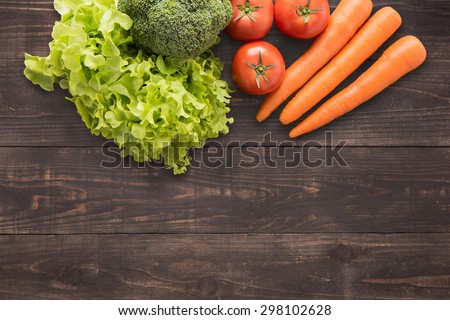 set of fresh vegetables on wood background with a lot of copy space for your text or editing.