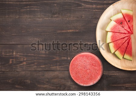 Healthy watermelon smoothie on a wood background with a lot of copy space for your text or editing.