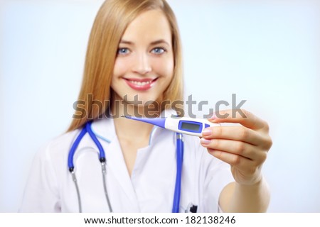 Digital thermometer. nurse holding a digital thermometer