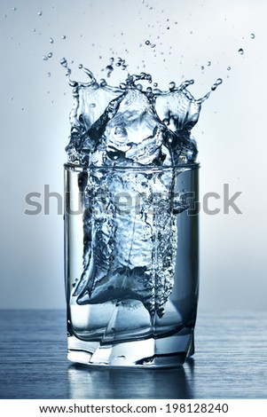 glass of water on light background