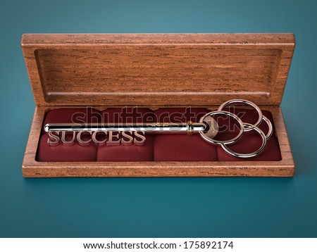 A silver key with the word Success