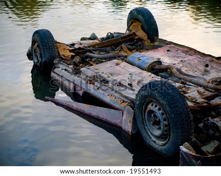 Rusty Dumped Car in Water Pond Lake Polluting
