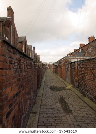 Old Northern British Cobbled Street Alleyway with Garden Walls