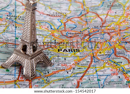 Eiffel Tower on a map of Paris, short focus
