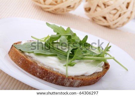 sandwich with cottage cheese on bread with rucola