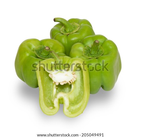 Several ripe green peppers cut one isolated on white background