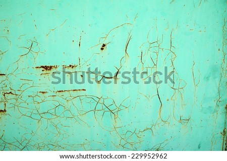 Texture of old iron covered with cracked walls, painted with green paint