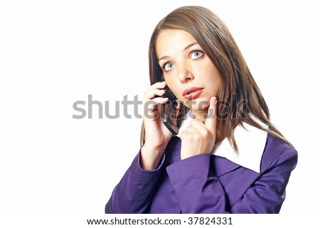 Pretty young office woman on violet jacket with finger on chin and cell phone