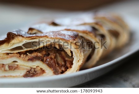 Pieces of Handmade Apple Strudel on a white dish