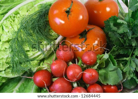 Garden radish, leaves of salad, tomatoes, cucumbers and parsley.