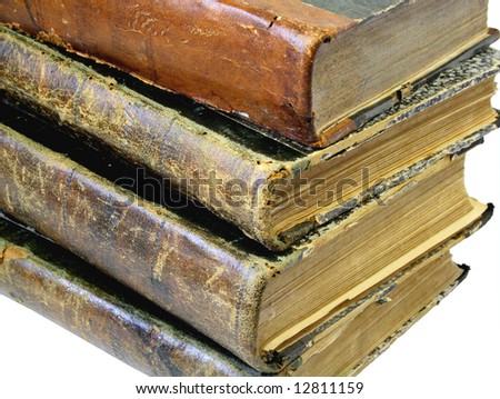 Pile from four old yellowed books on a white background.