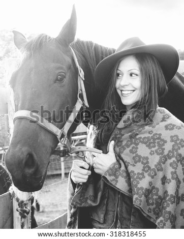 Beautiful woman with horse - fall fashion - black and white