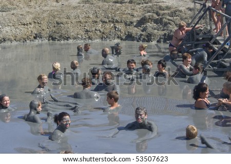 THOMANN - AUGUST 20: Feast of the gifts of nature, people take curative mud in the mud volcano. Event August 20, 2009 in Thomann, Russia.