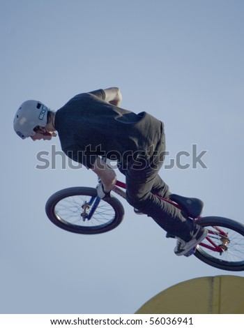 YEKATERINBURG - JUNE 26: Festival Youth Day. Demonstrative performance of extreme skaters and cyclists at the feast Day of Youth, sport BMX trial. Event 26 june, 2010 in Yekaterinburg, Russia.