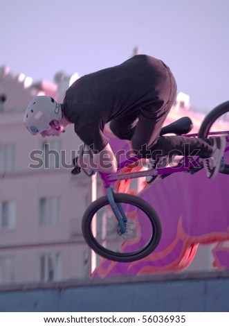 YEKATERINBURG - JUNE 26: Festival Youth Day. Demonstrative performance of extreme skaters and cyclists at the feast Day of Youth, sport BMX trial. Event 26 june, 2010 in Yekaterinburg, Russia.