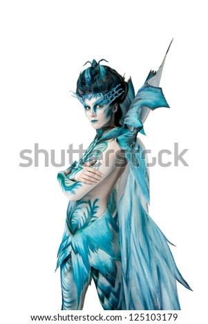a young girl dressed in a suit of the snow Queen on the white background