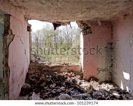 Mess in old broken house with lot of bricks
