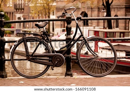 Black bike on the bridge in Amsterdam, Netherlands