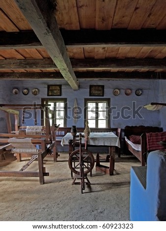 Old house interior with old equipment like spinning wheel