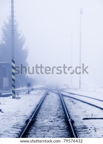 Perspective view of railroad in winter smog