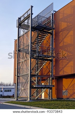 Steel stairs on an orange commercial building