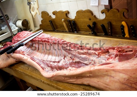 meat pig with knives in the kitchen