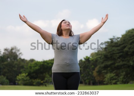 Obese woman breath of fresh air.