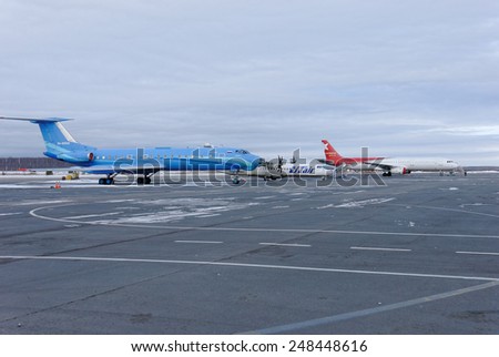 NIZHNY NOVGOROD. RUSSIA. January 26, 2015. STRIGINO AIRPORT. Planes of different models and airlines on an airfield of the airport of Strigino in Nizhny Novgorod