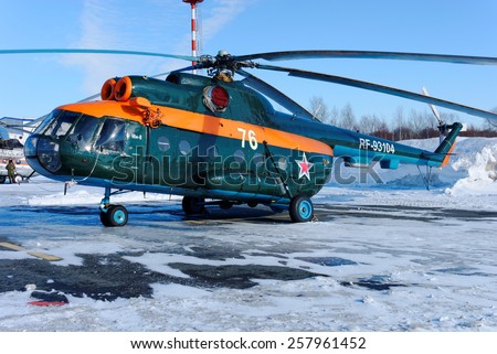 NIZHNY NOVGOROD. RUSSIA. FEBRUARY 17, 2015.  The dark green Mi-8 Helicopter of Volunteer society of assistance of army, aircraft and to fleet on the airport platform