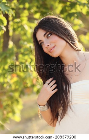Beautiful harmonious woman in the sunset forest. Bride. Tropical woman. Toning and softness