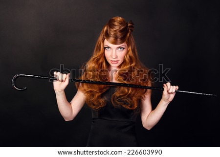 Fashion Portrait Of Luxury Woman With Red hair. hairstyle looks like a hat.