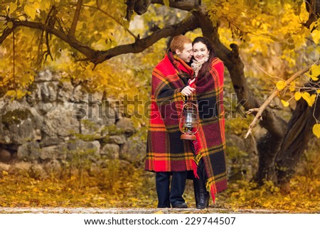 Happy young couple in love meeting on the autumn leaf . Autumn set. . love, relationship, family and people concept -