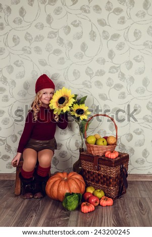 A child with a vegetable. Happy little girl with basket of vegetables, Gardening - lovely girl with ecological harvests. Lovely kid eating healthy food. studio.