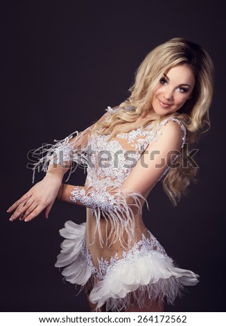 A modern interpretation of the White Swan. Girl in a sexual dress dancing in the  studio