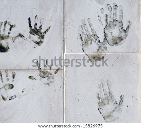 Human hands prints on the white wall