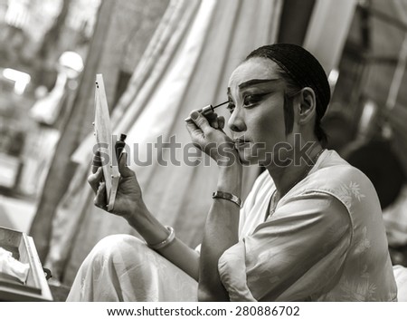 Bangkok, Thailand September 2014 -  At Joe Sue Kong the Chinese shrine in Yaowaraj.  In vegetarian festival every year, the actress is hurry doing her makeup to perform the Chinese Opera on stage.