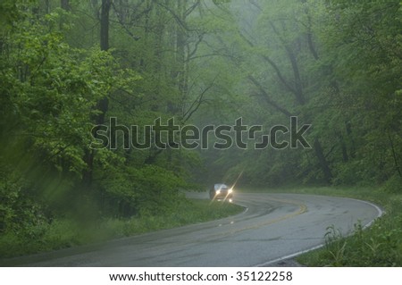 car driving on wet road in rain