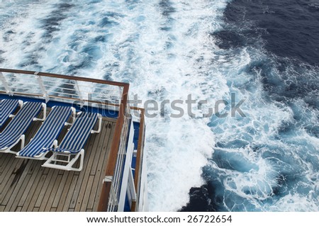 South Pacific cruise... looking onto empty deck chairs and rough seas.