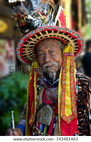 Old man in Chinese minority Naxi nationality dress in Lijiang