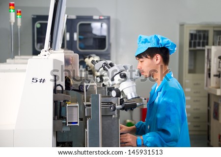 Chinese worker on factory check product quality
