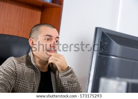 bald man looking on computer have surprise